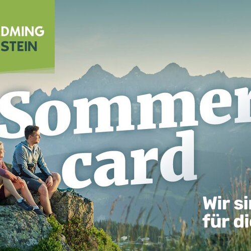 Mountain overlook with two hikers and Sommer card text
