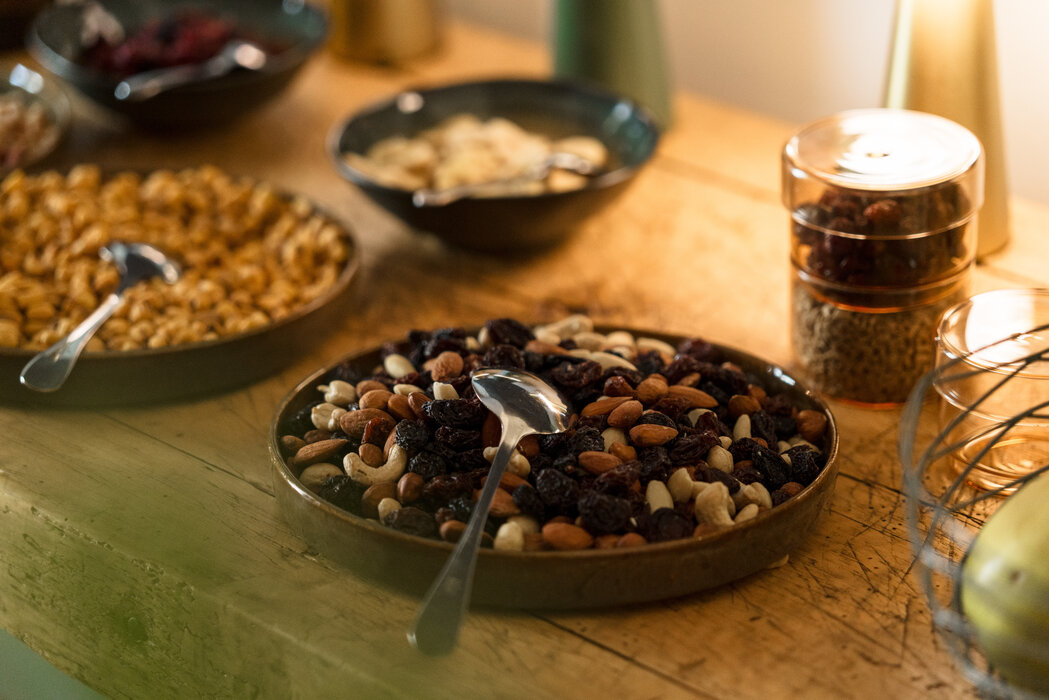 Bowl of mixed nuts and dried fruit on table