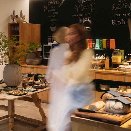 Buffet table with assorted dishes and pastries in café
